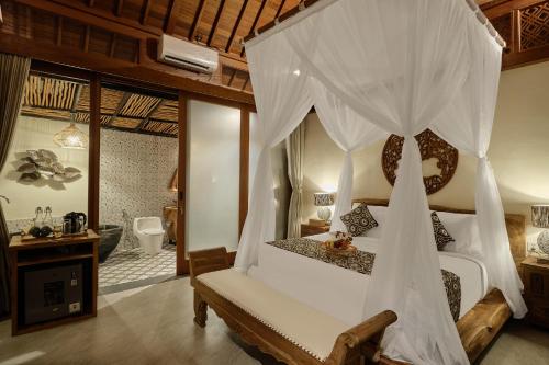 Ένα ή περισσότερα κρεβάτια σε δωμάτιο στο Changi Jungle Ubud Villas