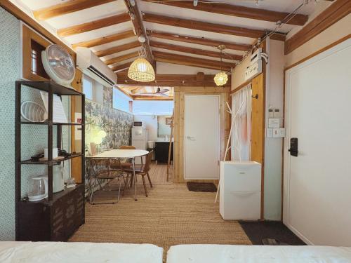 a room with a bed and a dining room with a table at 'Hanok Hanok' Boutique stay Hotel Seoul - 2min from Gyeongbokgung Palace station in Seoul