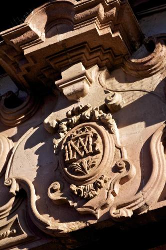a building with a design on the side of it at Casa de la Real Aduana Boutique Hotel in Pátzcuaro