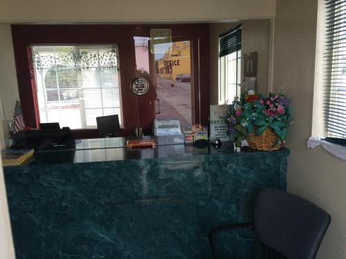 a lobby with a large marble counter in a room at San Carlos Inn in San Carlos