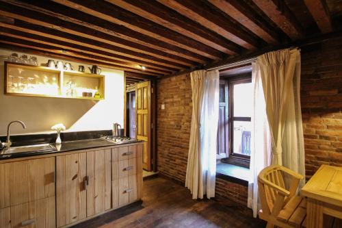 a kitchen with a sink and a window at Balcony apartment- 50m from Patan Durbar Sq in Pātan
