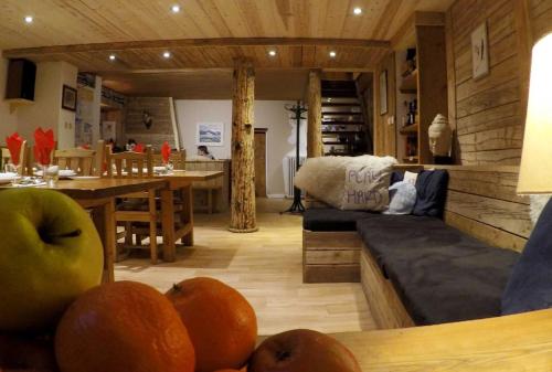 a kitchen filled with furniture and a table at Chalet Eterlou in Tignes