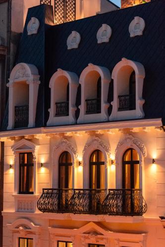 a white building with a black roof at Belle Epoque Boutique (Adult Only) in Constanţa