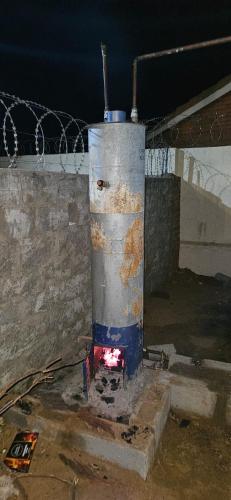 a pipe sitting on the floor of a building at The Kimberlite Camping & Caravan Parking, Jwaneng in Jwaneng