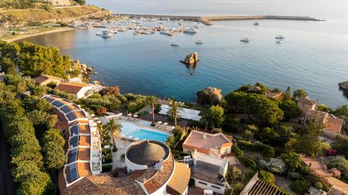 an aerial view of a resort with boats in the water at Le Calette N.5 in Cefalù