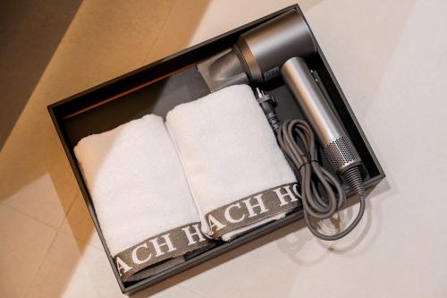 a box with a razor and towels in it at Pohang Yeongildae Beach Hotel in Pohang