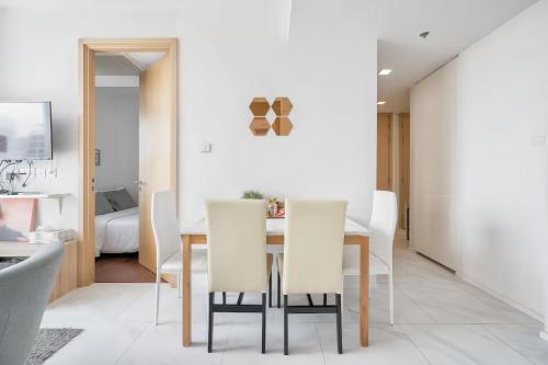 a dining room with a table and chairs at Hyde Sukhumvit 11 Bangkok in Bangkok