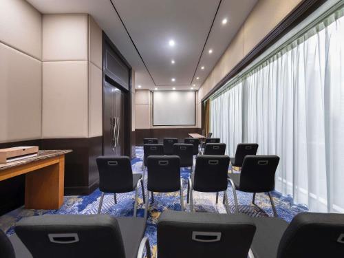 a conference room with a bunch of chairs in it at Novotel Kuala Lumpur City Centre in Kuala Lumpur