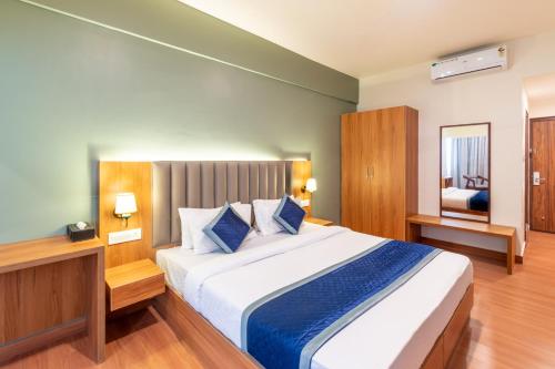 Postel nebo postele na pokoji v ubytování Hotel Vaari Vista