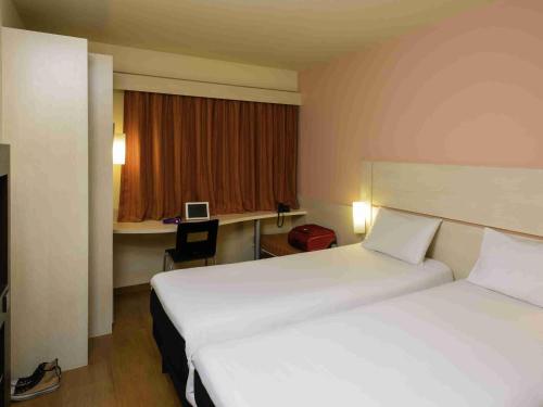 Cama o camas de una habitación en Ibis Joao Pessoa Praia