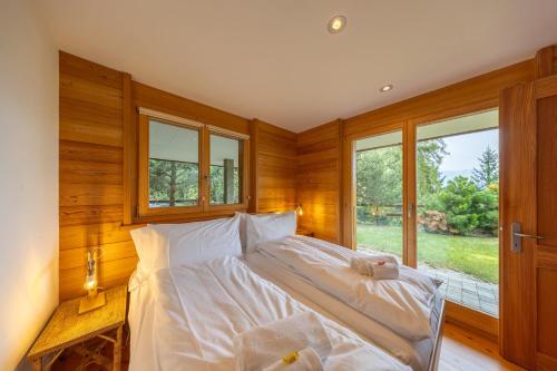 Ένα ή περισσότερα κρεβάτια σε δωμάτιο στο Chalet Nendaz - moderne et paisible