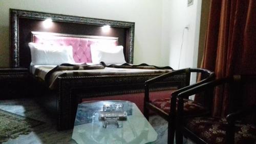 Postel nebo postele na pokoji v ubytování New Grand Hotel