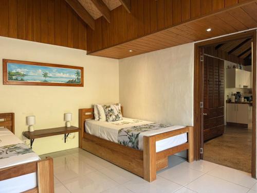 Una cama o camas en una habitación de Mokusiga Villas