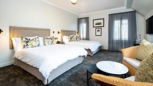 Postel nebo postele na pokoji v ubytování ANEW Hotel Hilton Pietermaritzburg