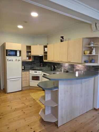 a kitchen with a large island in the middle at Baltic beach villa 2 in Jūrmala