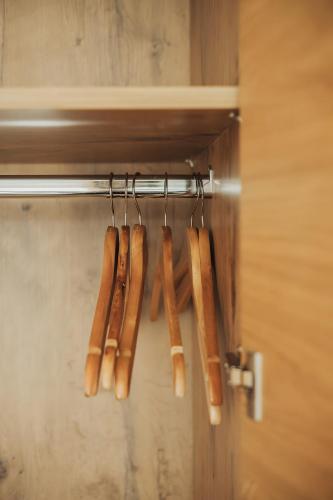 a group of hot dogs hanging on a rack at Oberegghof Ferienwohnung Garten in Rifiano