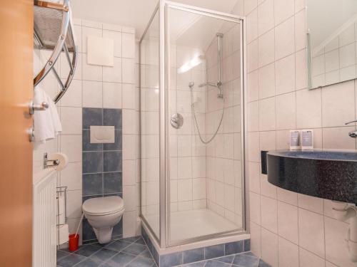 a bathroom with a shower and a toilet at Apartment in Neustift in a quiet location in Neustift im Stubaital
