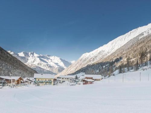 a ski lodge in the middle of a snowy mountain at Apartment in Neustift in a quiet location in Neustift im Stubaital