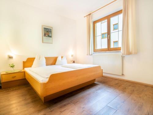 a bedroom with a bed and a window at Apartment in Neustift in a quiet location in Neustift im Stubaital