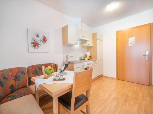 a living room with a couch and a table at Apartment in Neustift in a quiet location in Neustift im Stubaital