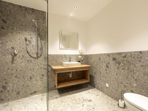 a bathroom with a sink and a shower at Apartment in Neustift in a quiet location in Neustift im Stubaital
