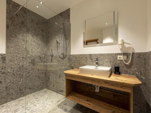 a bathroom with a sink and a shower at Apartment in Neustift in a quiet location in Neustift im Stubaital