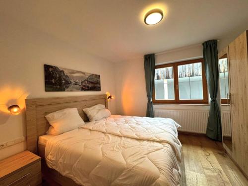 a bedroom with a bed and a window at Apartment in Neustift in a quiet location in Neustift im Stubaital