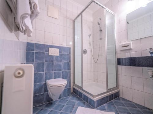 a bathroom with a shower and a toilet at Apartment in Neustift in a quiet location in Neustift im Stubaital