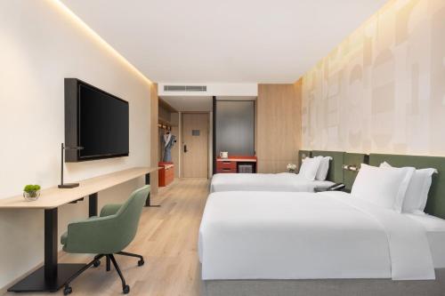 Ein Bett oder Betten in einem Zimmer der Unterkunft EVEN Hotel Hangzhou West Lake by IHG