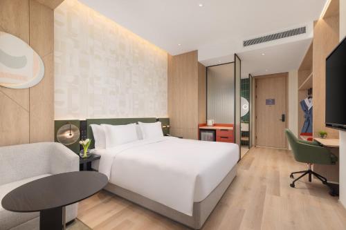 Ein Bett oder Betten in einem Zimmer der Unterkunft EVEN Hotel Hangzhou West Lake by IHG