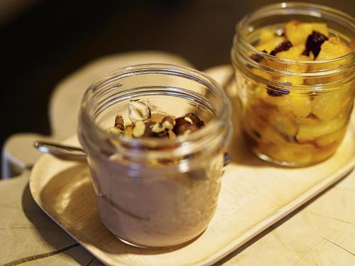 two jars of food on a plate on a table at Mercure Valence in Valence