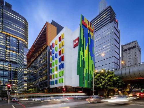 a building with colored squares on it in a city at ibis Sydney Barangaroo in Sydney