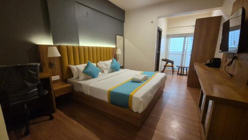 Postel nebo postele na pokoji v ubytování Hotel Vaari Vista