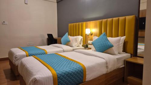 Postel nebo postele na pokoji v ubytování Hotel Vaari Vista