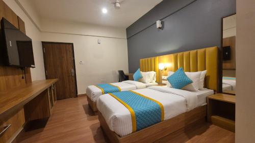 Postel nebo postele na pokoji v ubytování Hotel Vaari Vista