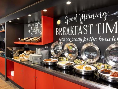 a bakery with a buffet of food on display at ibis Brighton City Centre - Station in Brighton & Hove
