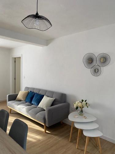 a living room with a couch and a table at Casa da Ribeirinha in Sertã