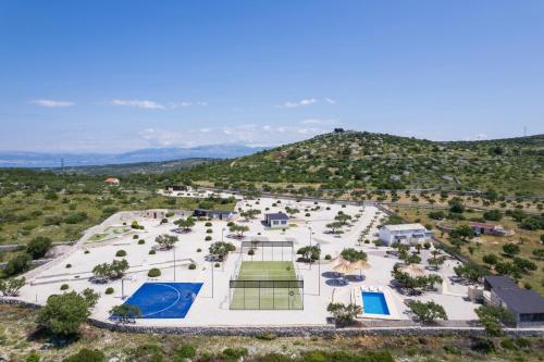 an aerial view of a resort with a mountain in the background at Hacienda Nikolic in Milna