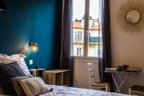 En eller flere senge i et værelse på Studio port de Nice