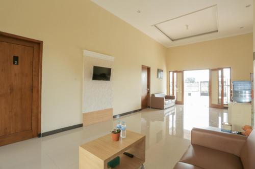 Televisyen dan/atau pusat hiburan di IDR Green Guest House Syariah Mitra RedDoorz