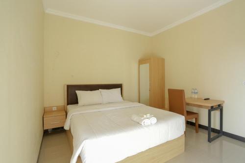 Katil atau katil-katil dalam bilik di IDR Green Guest House Syariah Mitra RedDoorz