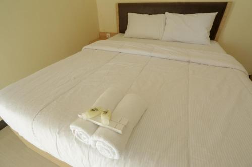 Katil atau katil-katil dalam bilik di IDR Green Guest House Syariah Mitra RedDoorz