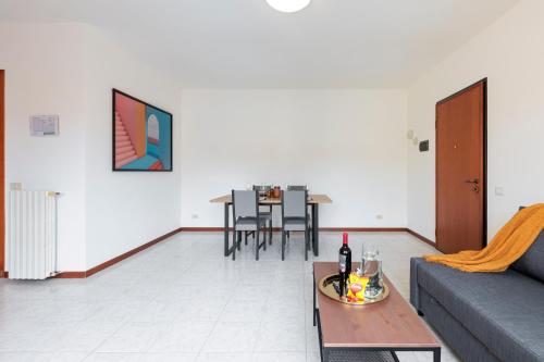a living room with a couch and a table at BGY Colorful Home in Grassobbio