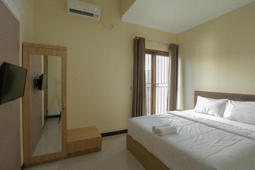 Katil atau katil-katil dalam bilik di IDR Green Guest House Syariah Mitra RedDoorz