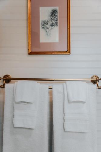 two towels hanging on a towel rack in a bathroom at The Underwood-Hale House in Providence