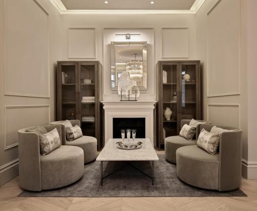 a living room with two chairs and a coffee table at The Hotel Maria Helsinki in Helsinki
