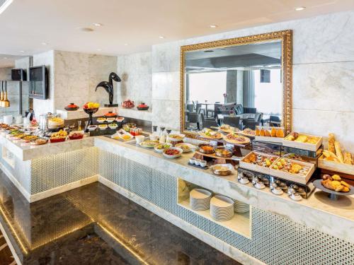 a buffet line with many different types of food at Sofitel Macau At Ponte 16 in Macau