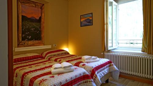 Letto o letti in una camera di Soggiorno Dolomiti