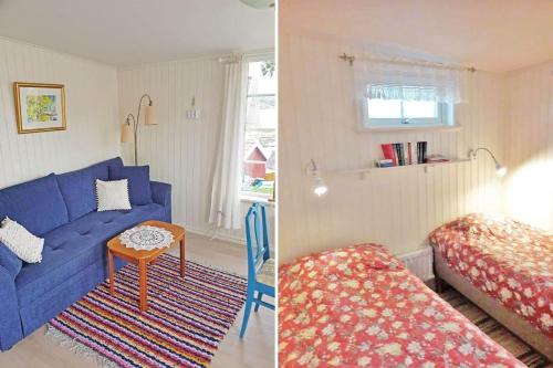 a living room with a blue couch and a bed at BOH668-Kloevedal-Bjoerholmen-81 in Björholmen