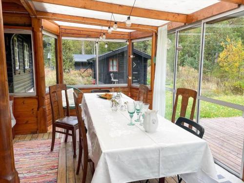 a table on the porch of a house at KRO771-Russby-Rungebacken-Uddeboda-3 in Piggaboda